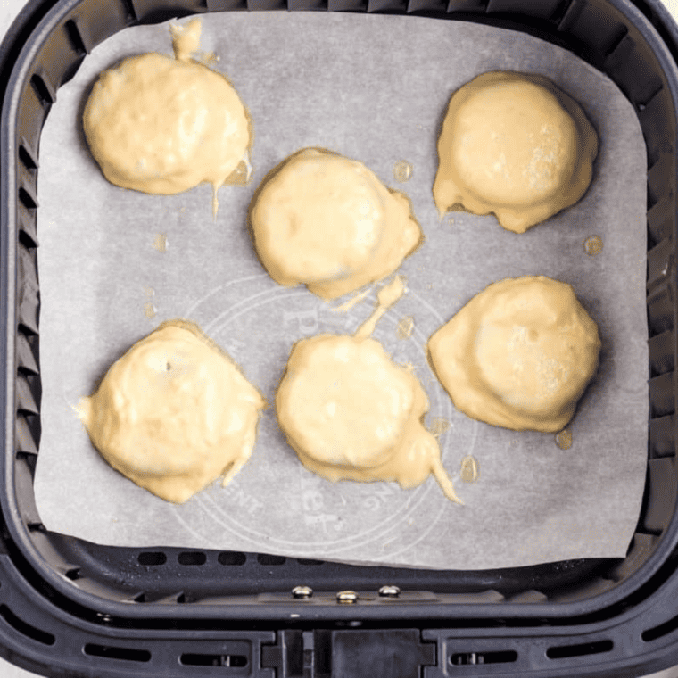 Air fryer cooking Oreos at 370°F, flipping halfway, golden and crispy, cooling on a wire rack.