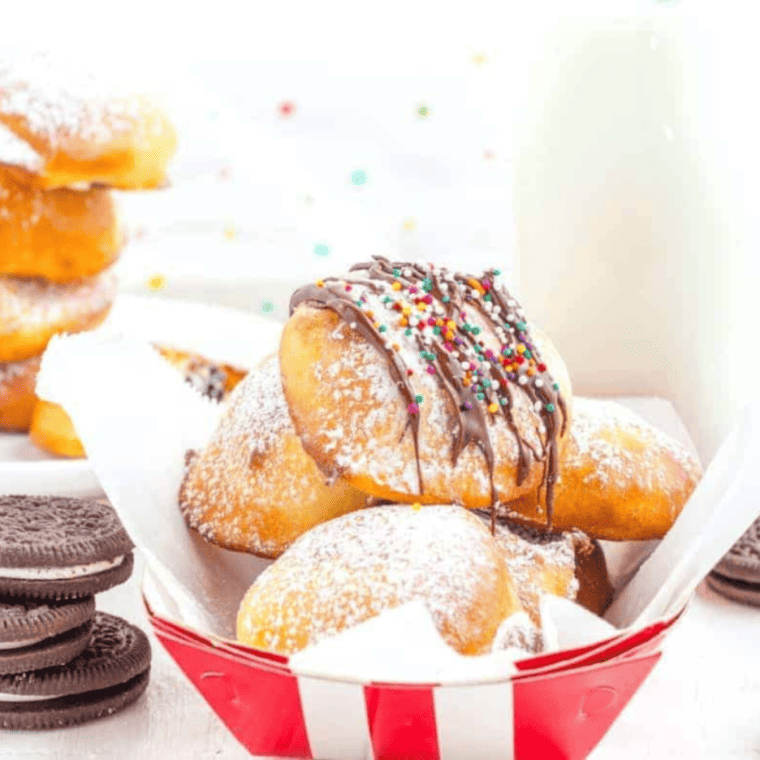 Air fried Oreos coated in pancake batter, golden and crispy on a plate.