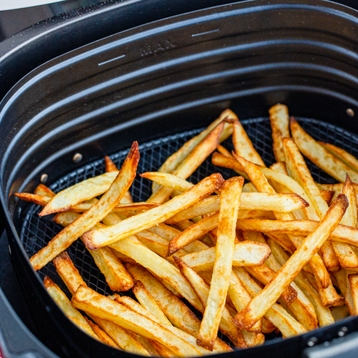 Cooked Copycat McDonald’s French Fries in the air fryer basket.