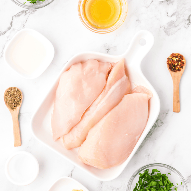 Ingredients for Air Fryer Italian Dressing Chicken laid out on the table