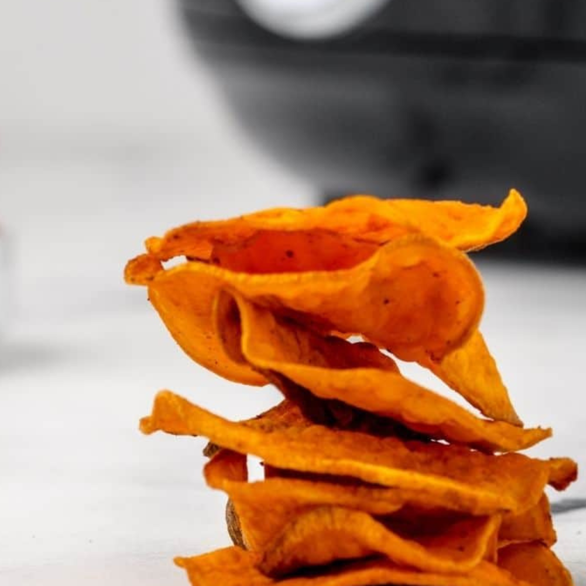 Healthy homemade air fryer sweet potato chips served as a snack.