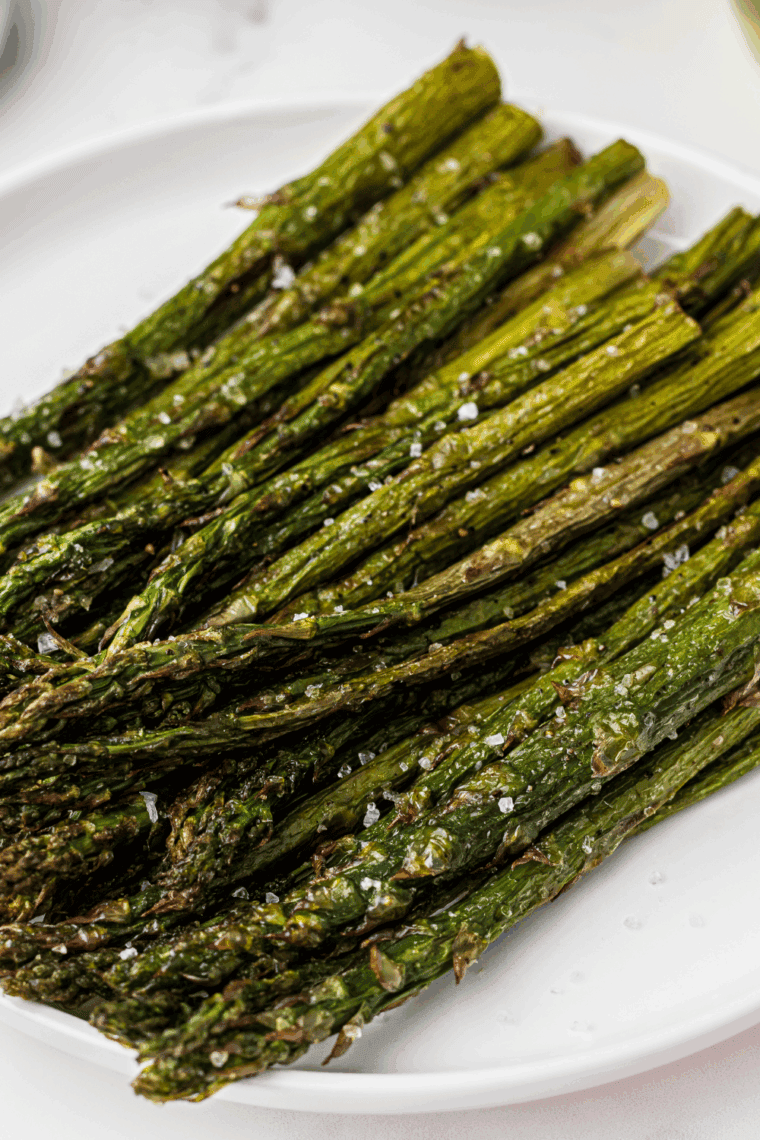 Cooked Blackstone asparagus transferred to a serving platter