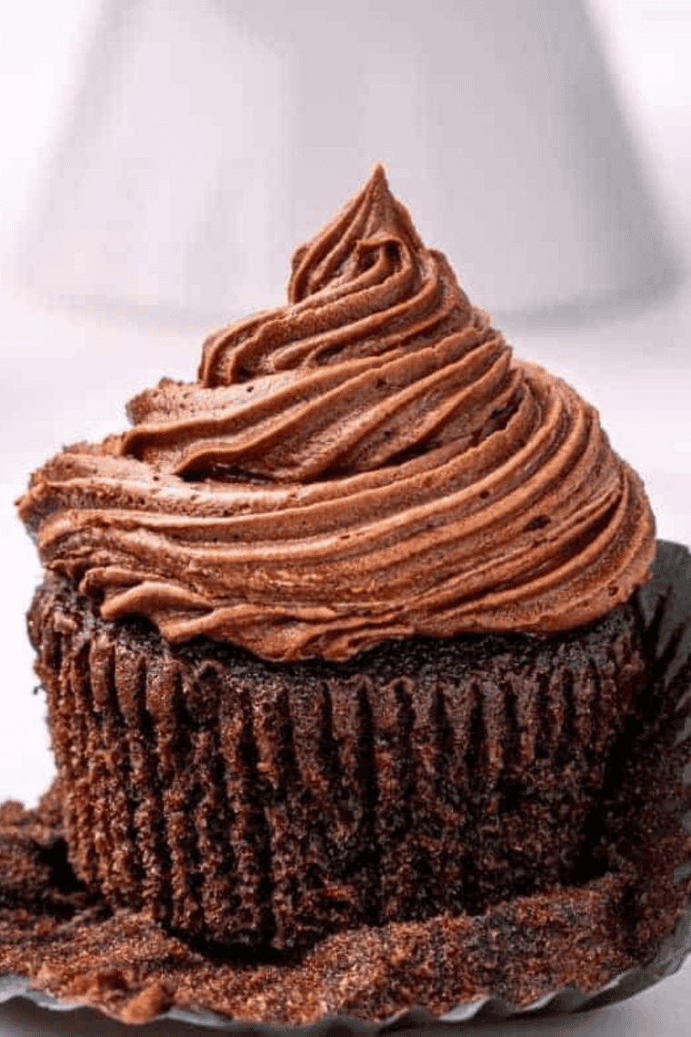 Freshly baked air fryer chocolate cupcakes with soft, fudgy centers and slightly crisp edges.