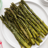 Parmesan-roasted asparagus inspired by Olive Garden, featuring tender asparagus spears topped with melted cheese and crispy golden edges.