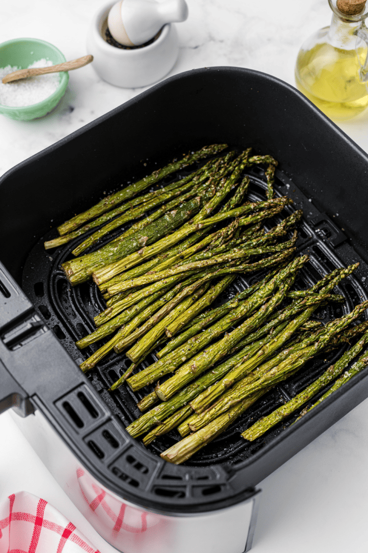 Olive Garden Parmesan Roasted Asparagus with crispy golden edges, served as a flavorful side dish.