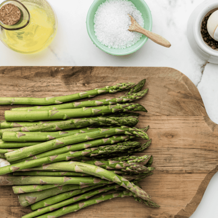 Ingredients needed for Olive Garden Parmesan Roasted Asparagus on kitchen table.