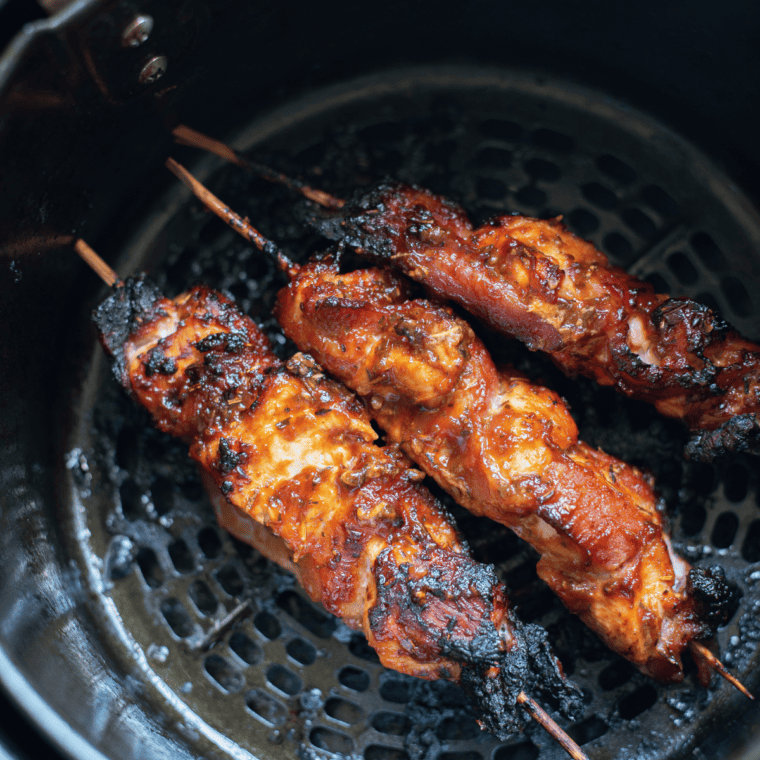 Air Fryer Bacon Wrapped Chicken Bites: Tender chicken wrapped in crispy bacon, cooked to perfection in the air fryer.