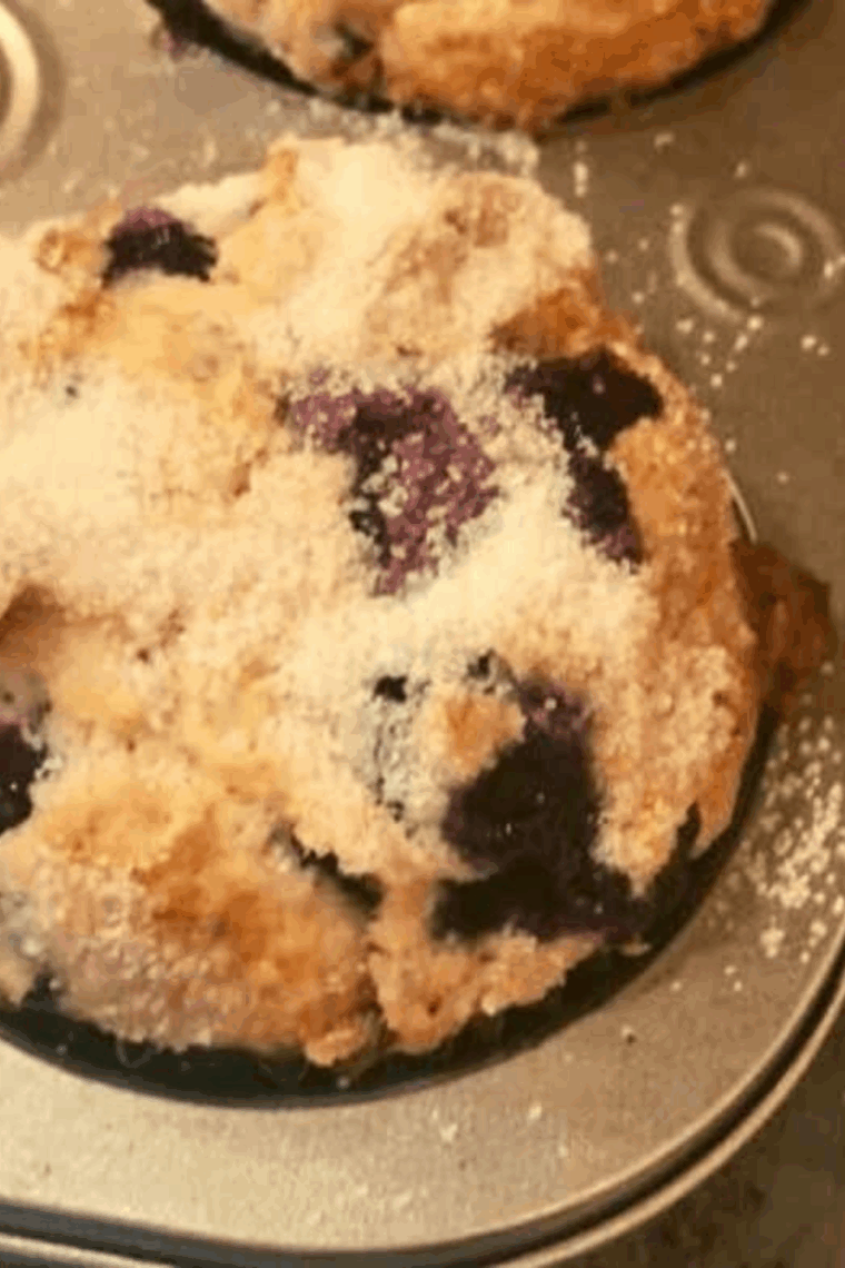 Air fryer berry cream muffins with creamy centers and mixed berries