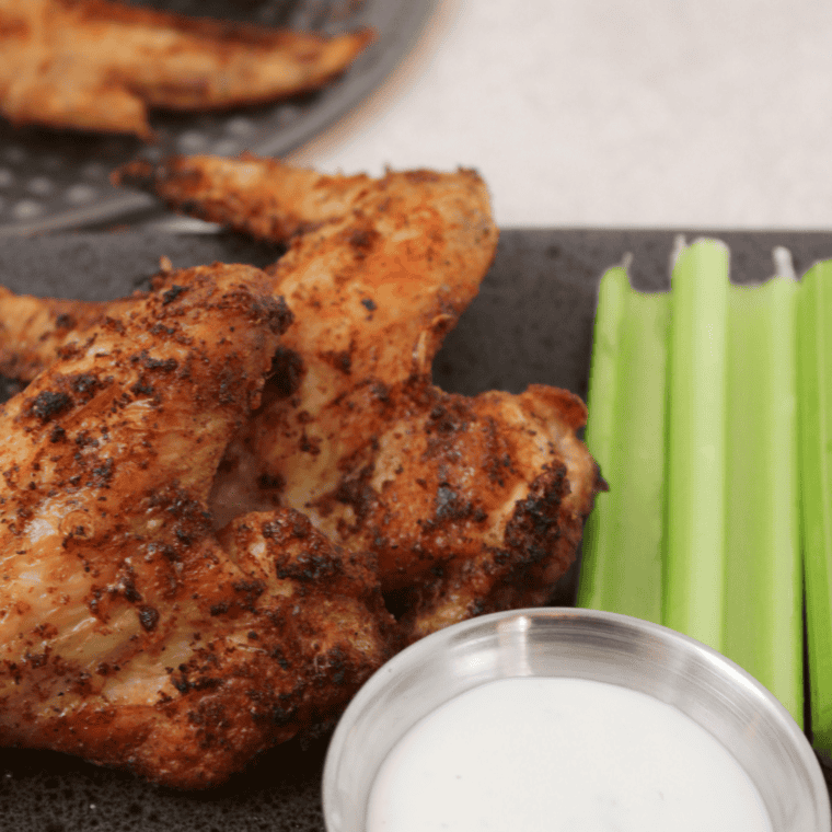 Crispy air fryer dry rubbed chicken wings on a plate