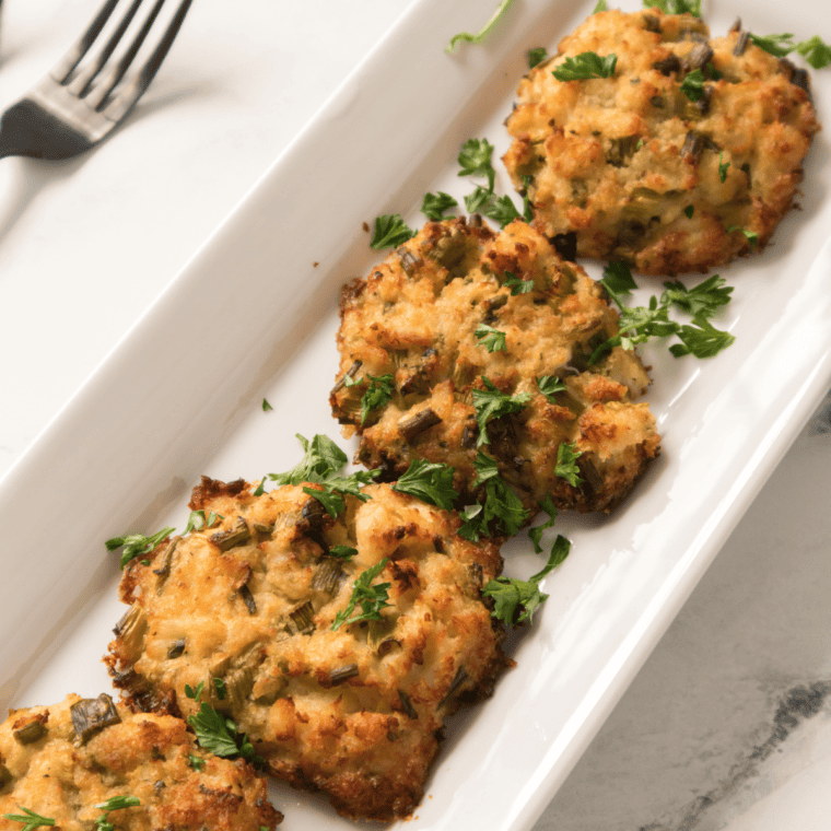 Plate of lemon crab cakes on a plate, reading for serving.