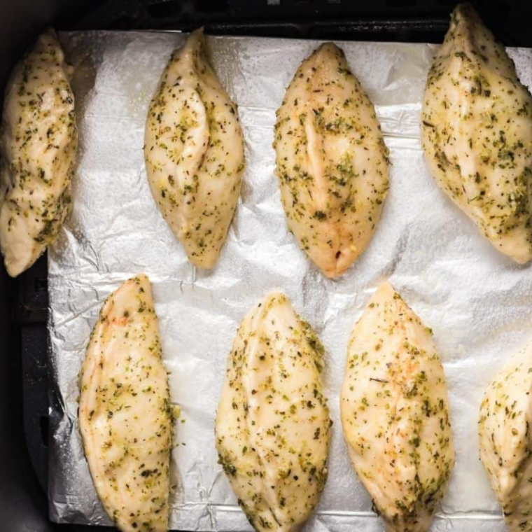 Placing pizza pockets in the air fryer for a quick and easy cook.