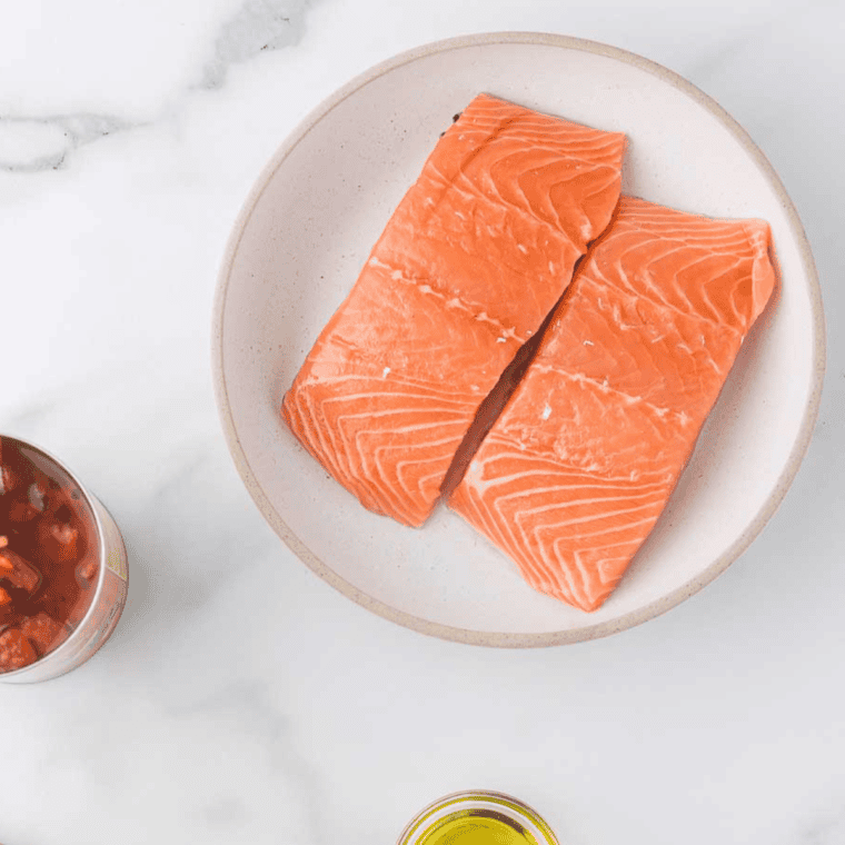 Ingredients needed for Air Fryer Salmon With Mushroom Sauce on kitchen table.