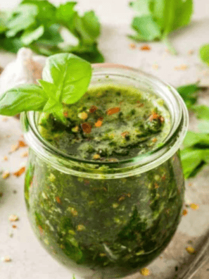 A bowl of homemade Bonefish Grill chimichurri sauce, featuring fresh herbs, garlic, and a vibrant green color, ready to serve.