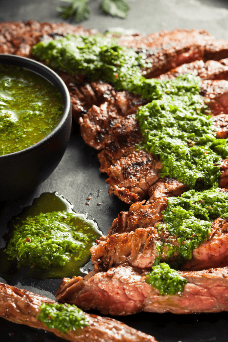 A bowl of homemade Bonefish Grill chimichurri sauce with fresh herbs, garlic, and a vibrant green color, ready to serve.