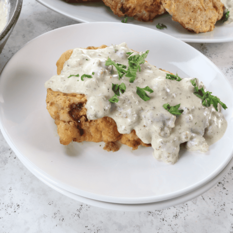Crispy golden chicken fried steak topped with creamy white gravy, served Cracker Barrel style.