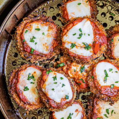 Cheesecake Factory eggplant parmesan with crispy breaded slices, marinara sauce, and melted mozzarella cheese