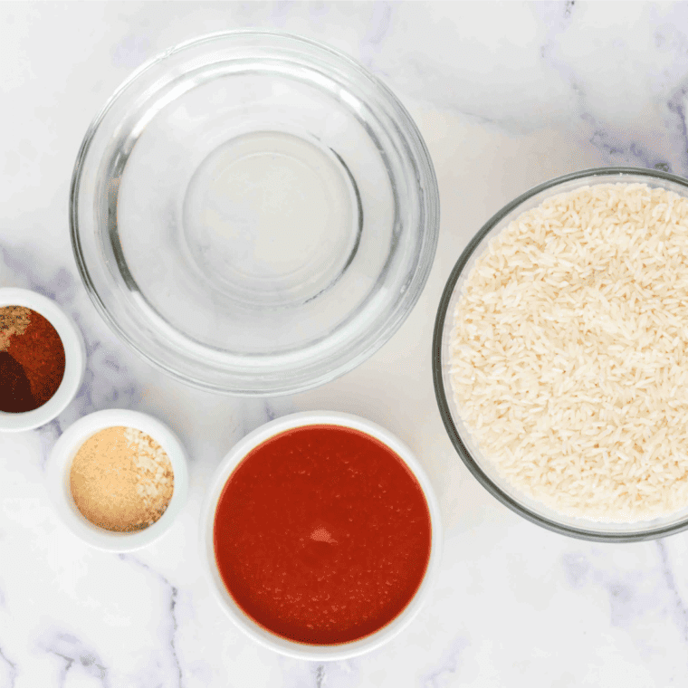 Ingredients needed for Instant Pot Spanish Rice (Easy, Fluffy, Restaurant-Quality in 20 Minutes!) on kitchen table.
