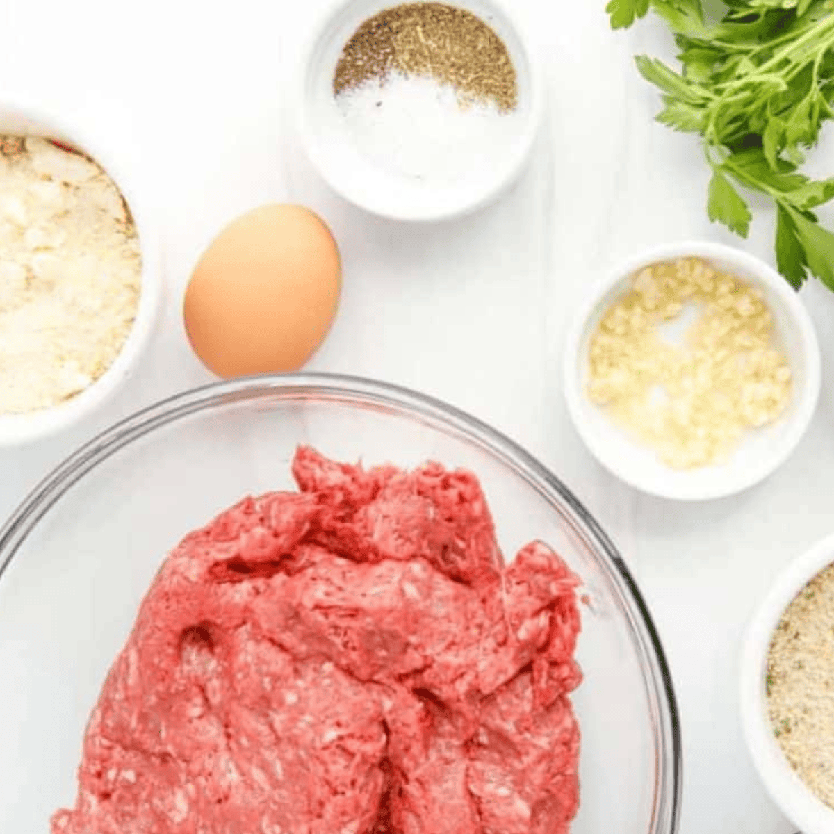 Ingredients needed for Olive Garden Meatballs on kitchen table.
