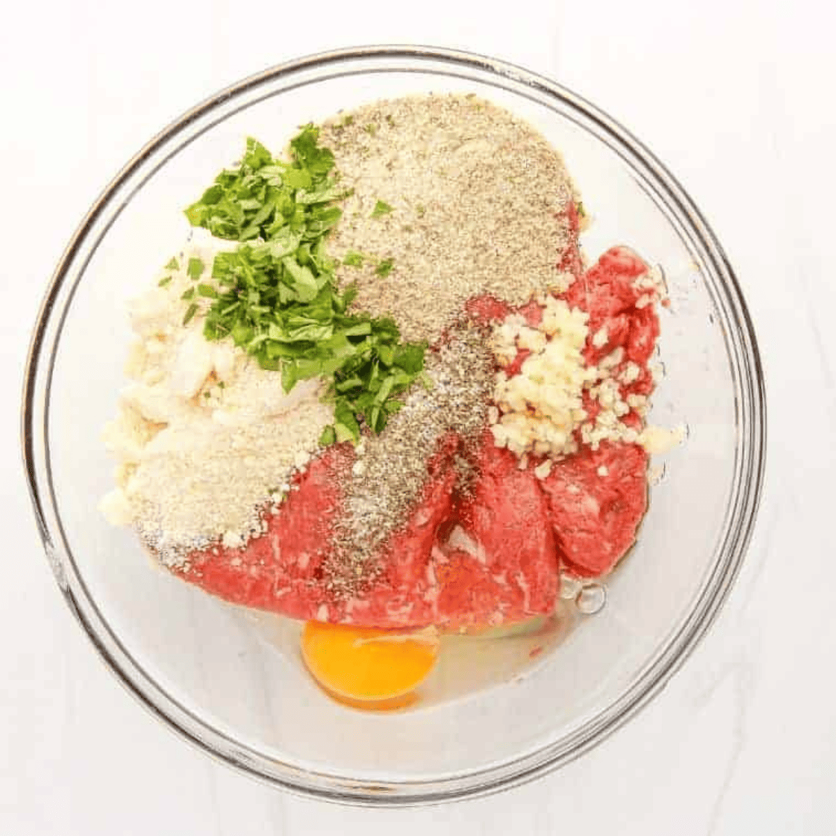 Mix Olive Garden Meatball ingredients into a large mixing bowl.
