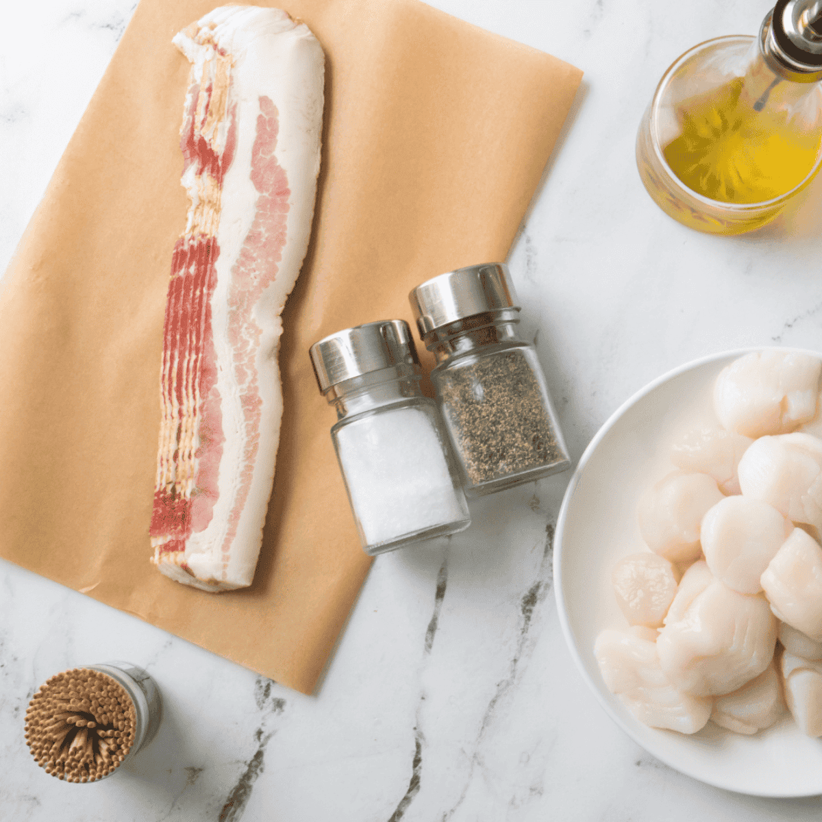 Ingredients needed for Red Lobster Bacon Wrapped Scallops Recipe on kitchen table.