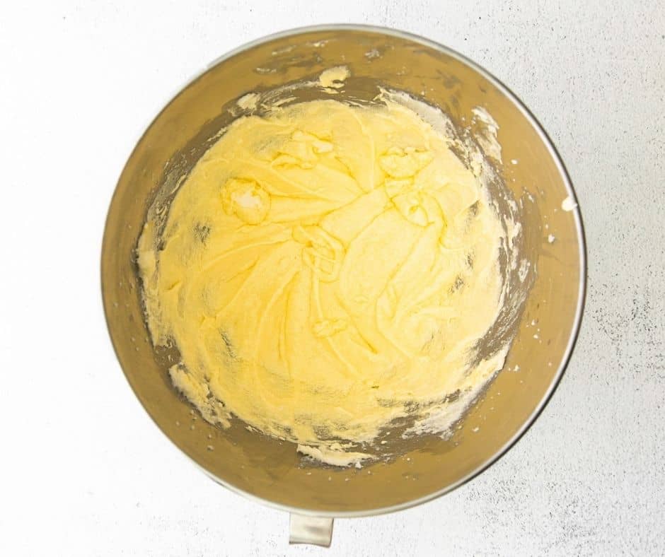 Cream the butter and sugar in a large mixing bowl.