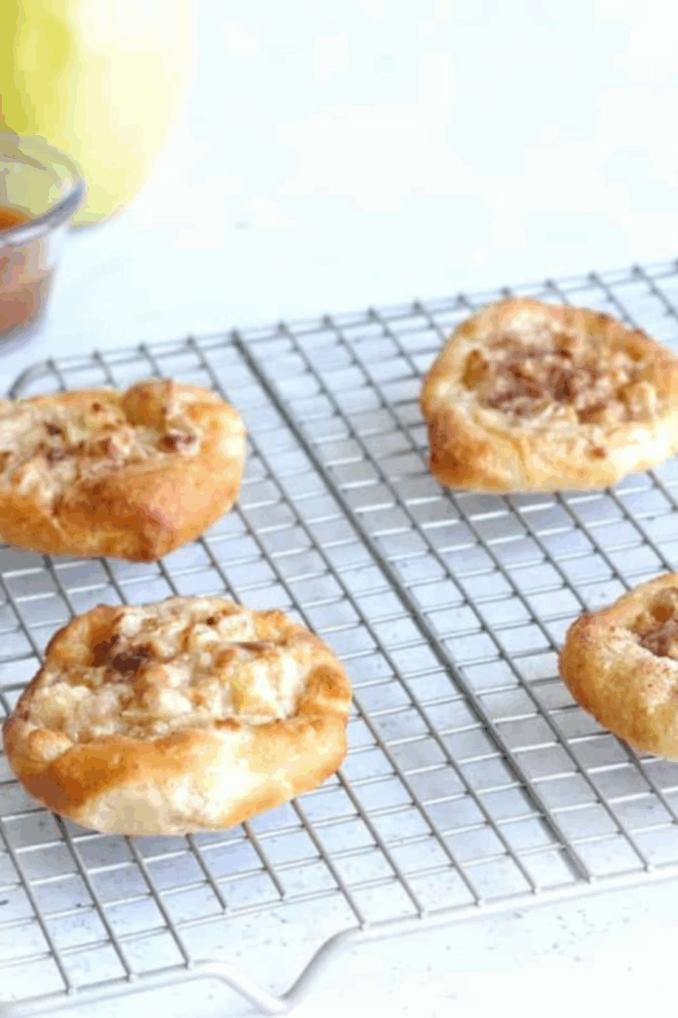Golden, flaky air fryer apple Danish filled with cinnamon apples and drizzled with caramel.