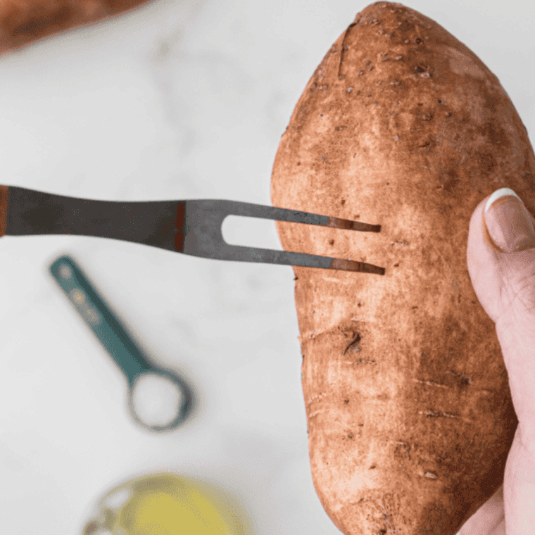 Sweet potatoes rubbed with olive oil and pricked with a fork before air frying