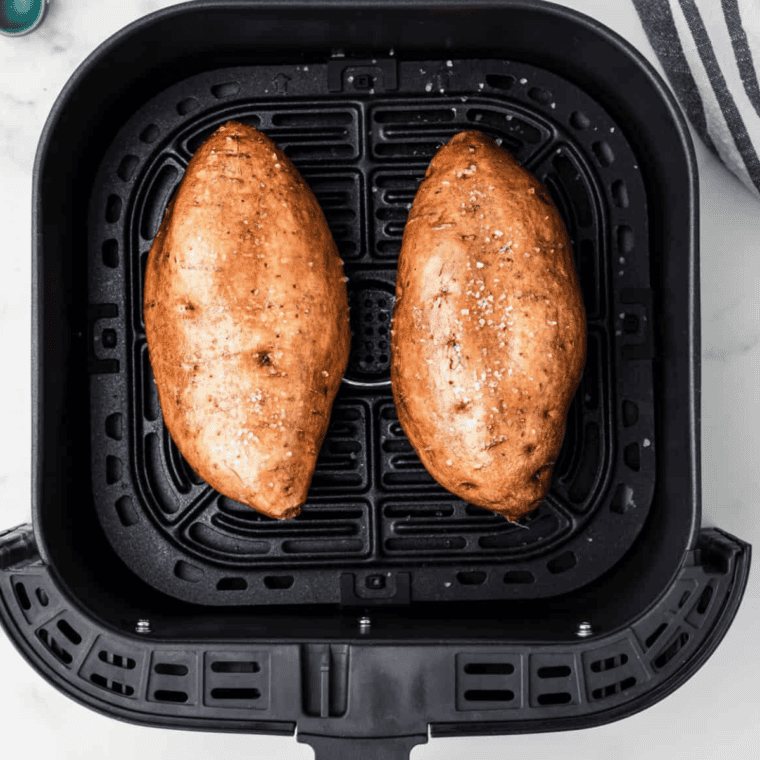 Sweet potatoes air frying at 400°F until fork-tender