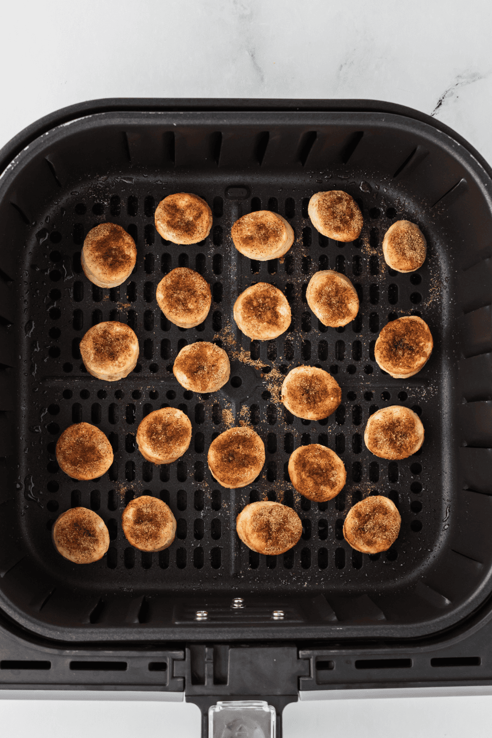 Air frying bananas at 400°F and adding sparkling sugar and oats.