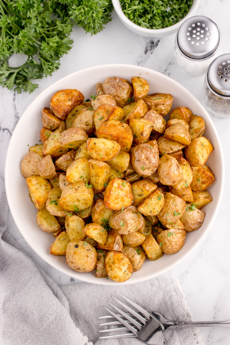 Rosemary potatoes served as a side dish next to a main course