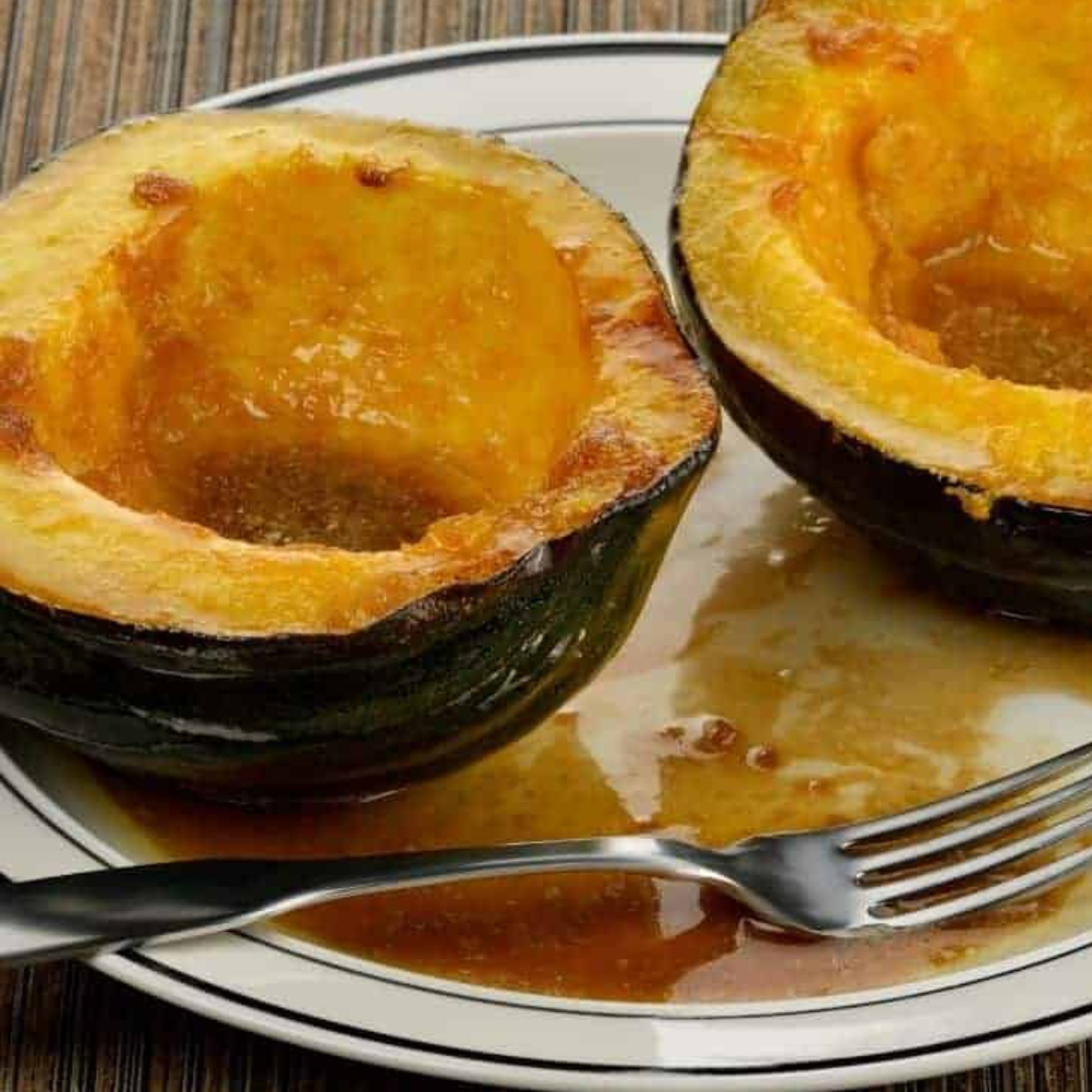 Plated Air Fryer Acorn Squash, beautifully arranged with a sprinkle of seasoning.