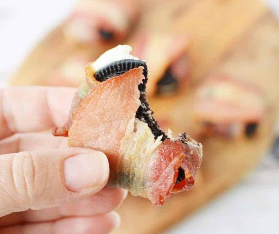 Cooked Air Fryer Bacon Wrapped Oreos displayed on a plate, golden brown and crispy, ready to be served.
