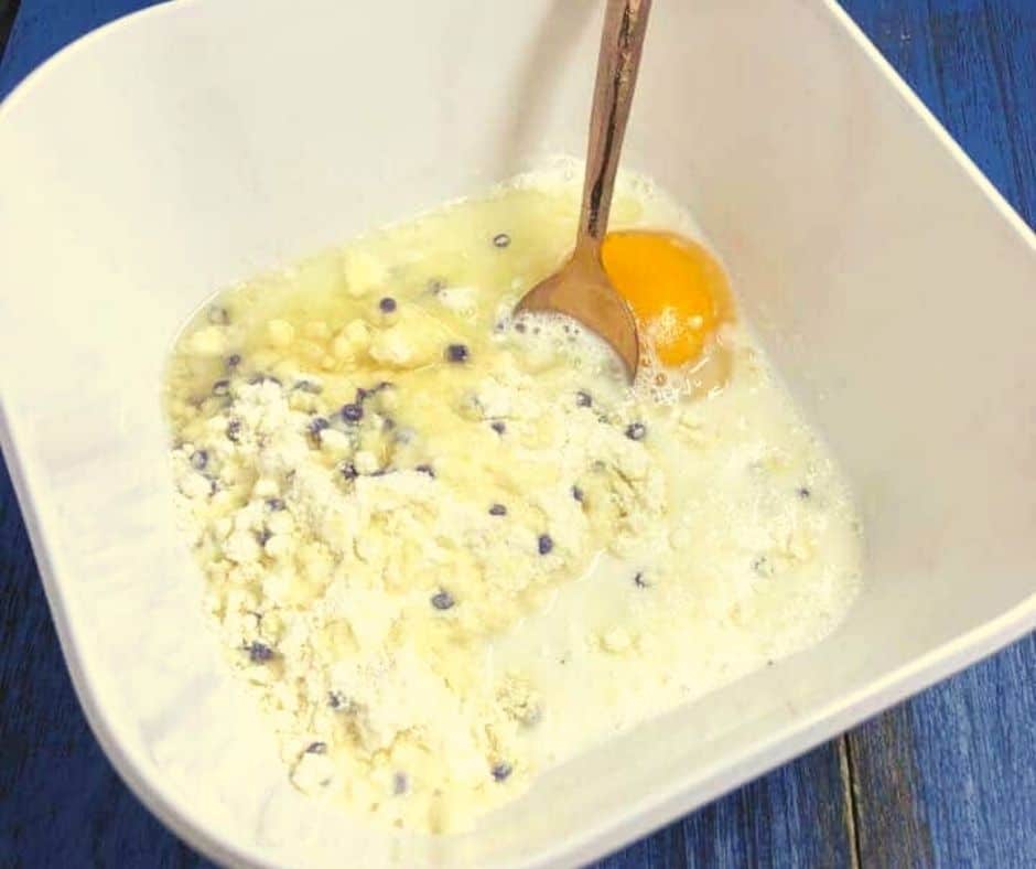 Mix the egg, milk, mix, and oil together. Then fold in 1/2 cup of blueberries (optional)