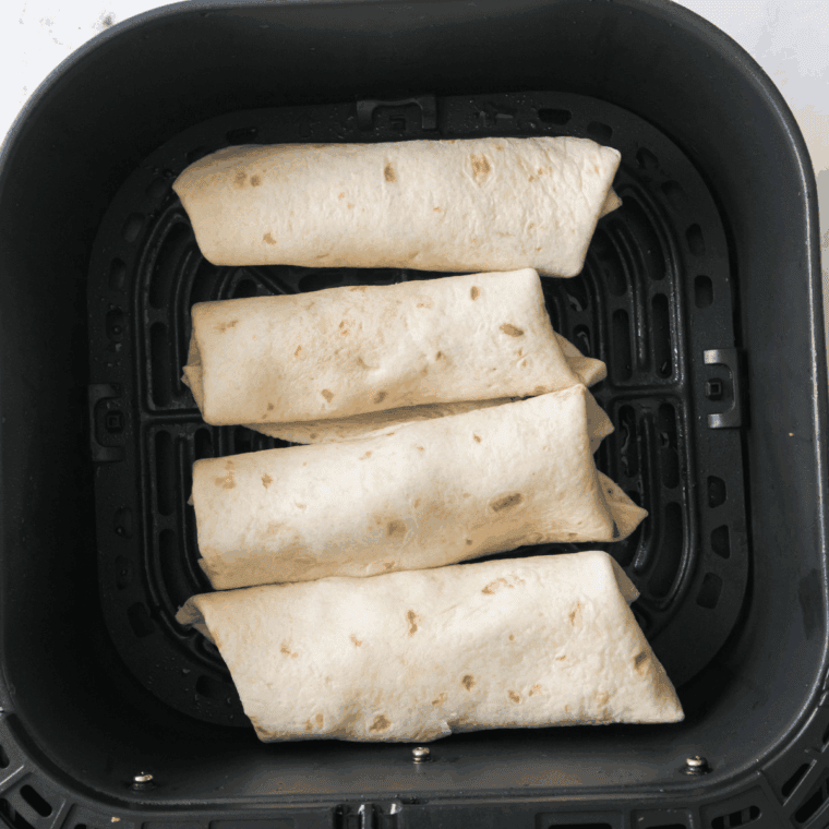 Place chimichangas in air fryer basket in single layer, cook at 400°F for 10–12 minutes, flipping halfway.