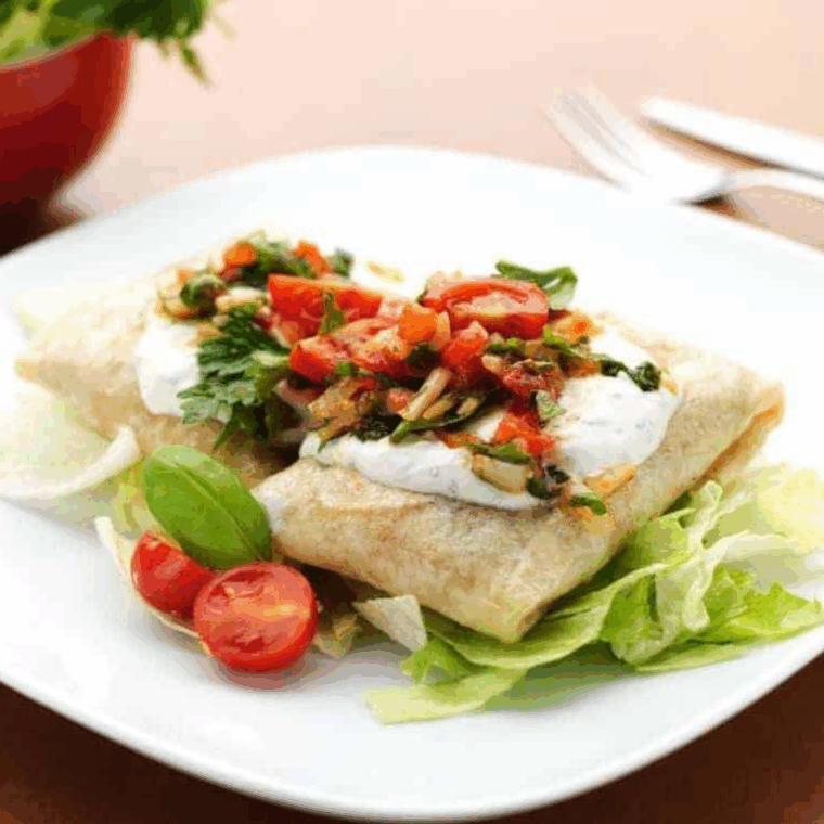 Remove golden, crispy chicken chimichangas from air fryer and serve with dipping sauces like salsa or sour cream.