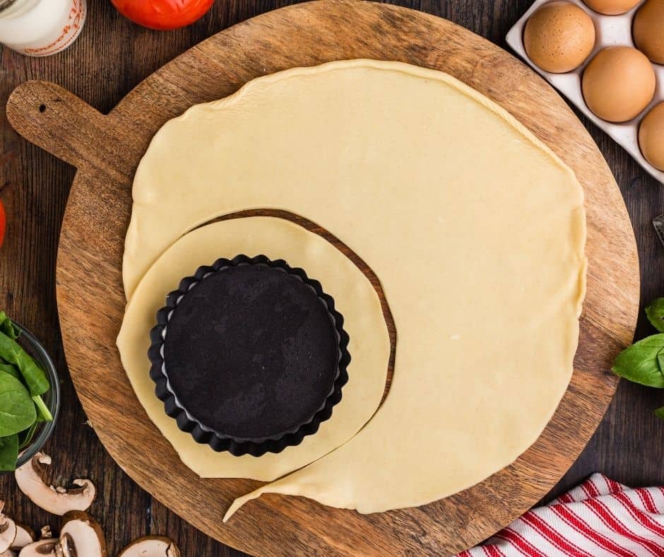 Cut the pie crust out per the size of the baking tart.