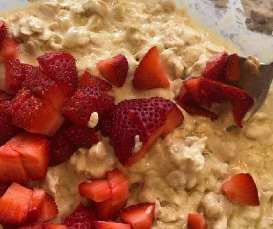 Add fresh strawberries to the oatmeal mixture.