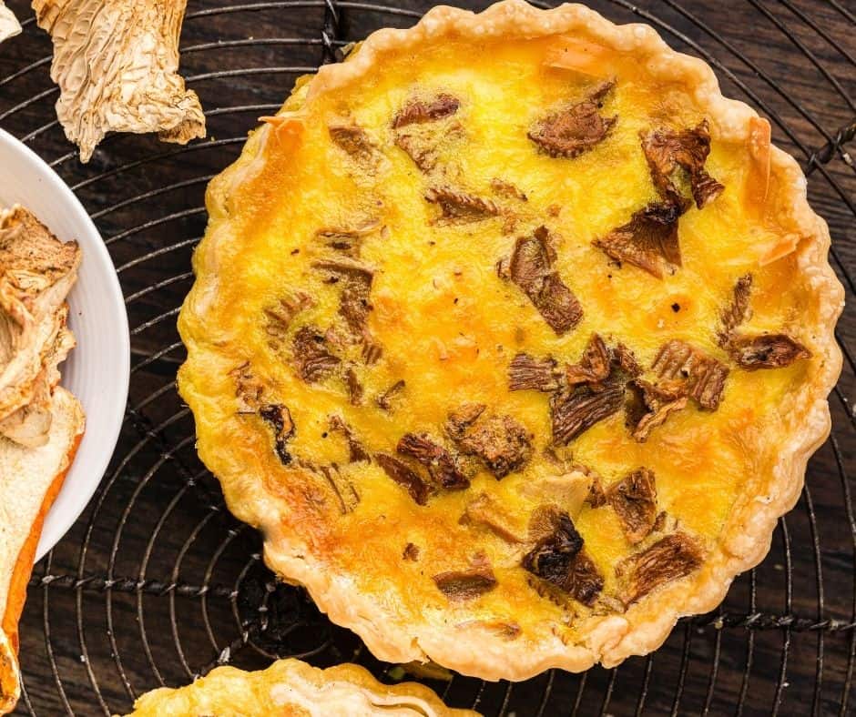 "Sliced Air Fryer Wild Mushrooms and Smoked Gouda Quiche showing creamy texture"