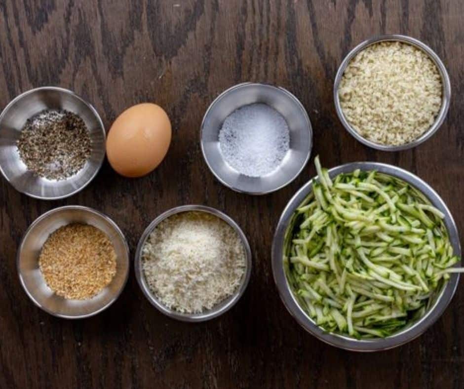 Ingredients Needed For Air Fryer Zucchini Tots on wooden kitchen table.