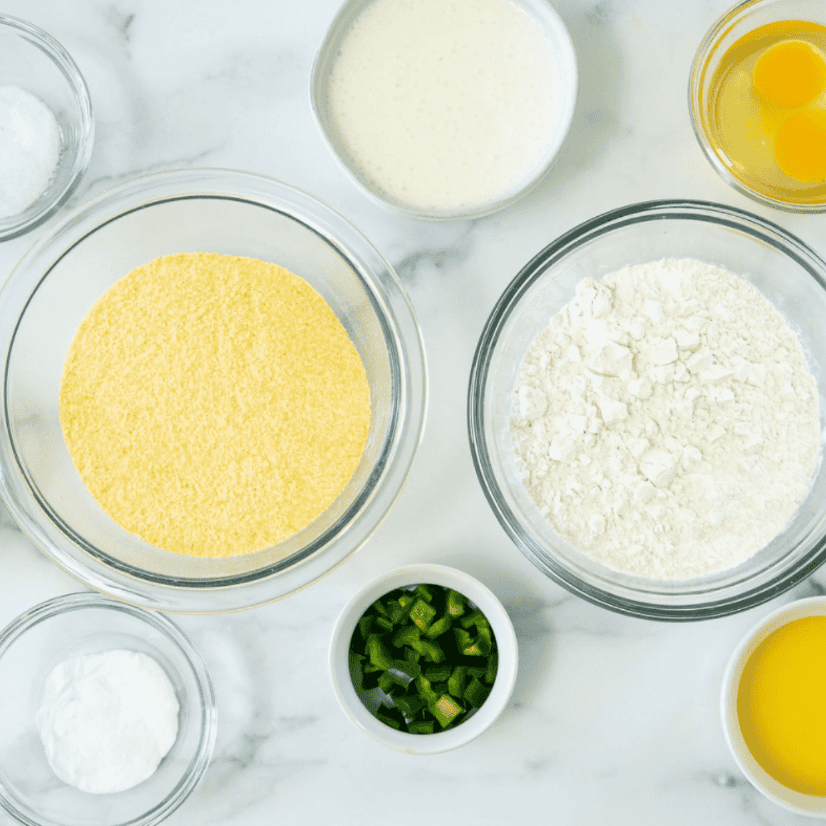 Ingredients needed for Arthur Treacher’s Hush Puppies Copycat Recipe on kitchen table.