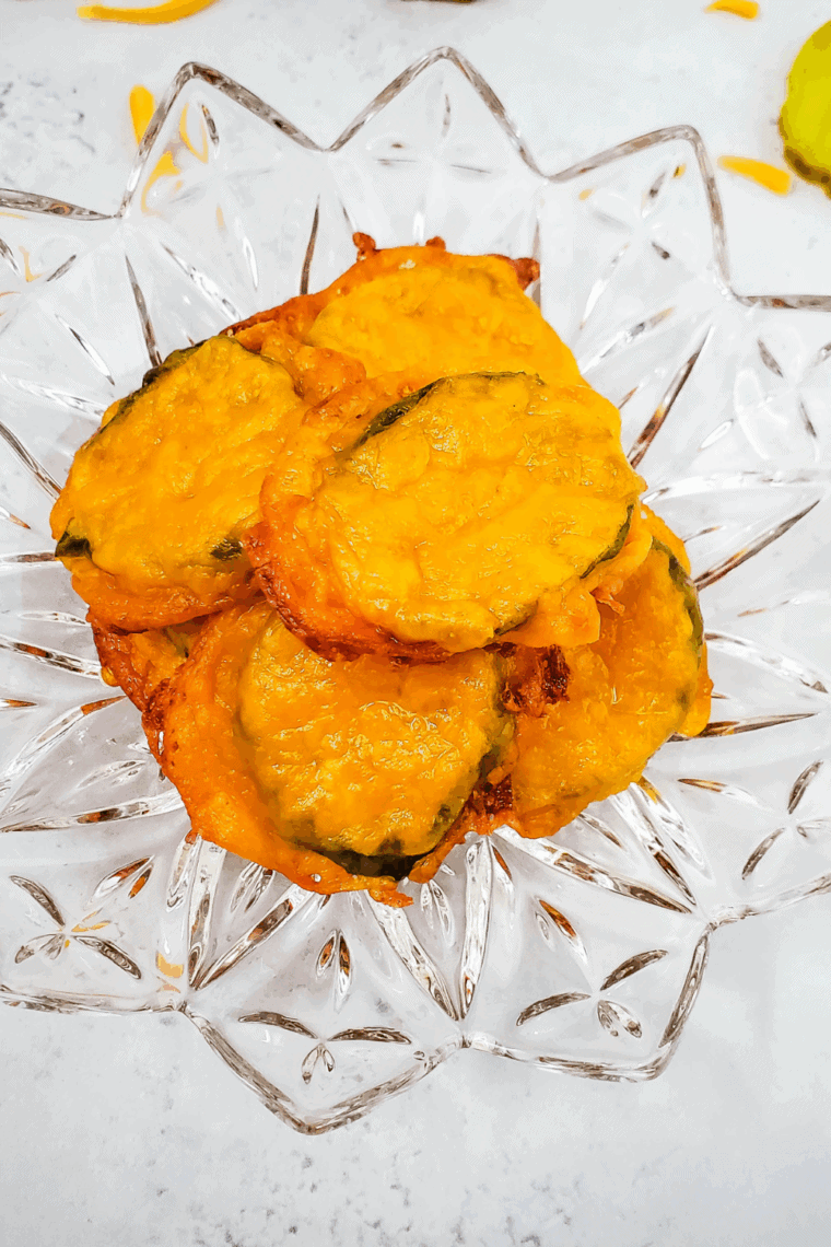Golden, crispy air fryer cheese pickles in a basket, ready to serve