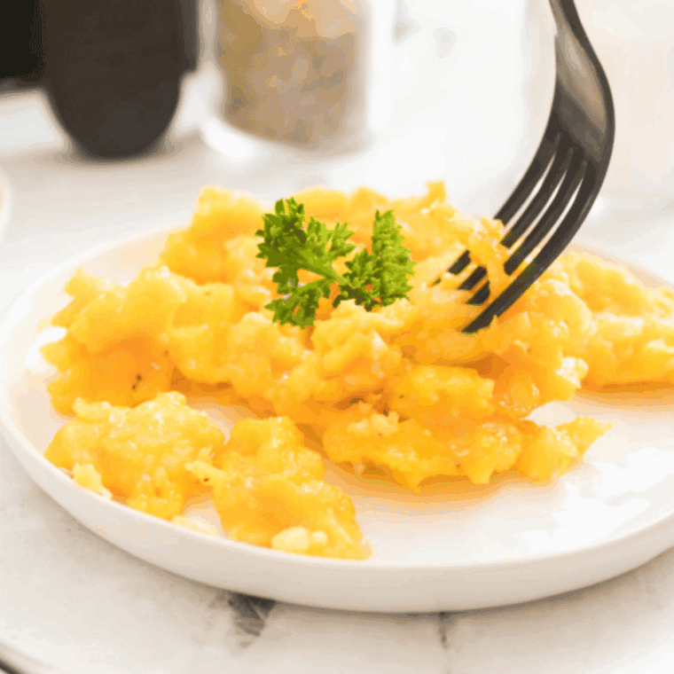 Fluffy scrambled eggs cooking in an Instant Pot.