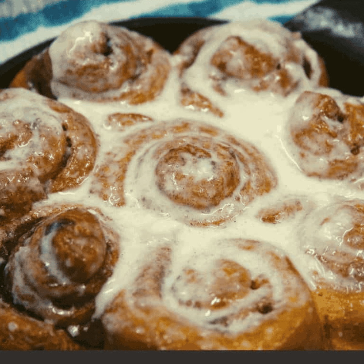 Wendy’s Cinnabon Pull-Apart with cinnamon sugar glaze and cream cheese frosting in air fryer basket.