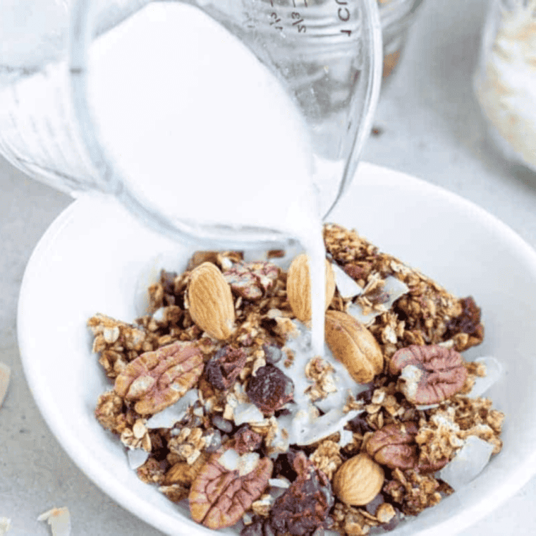 Close-up of toasted air fryer granola clusters with coconut flakes