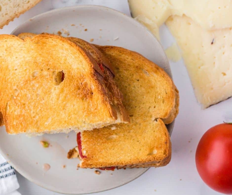 Golden Air Fryer Spanish Manchego Grilled Cheese sandwich with melted cheese.