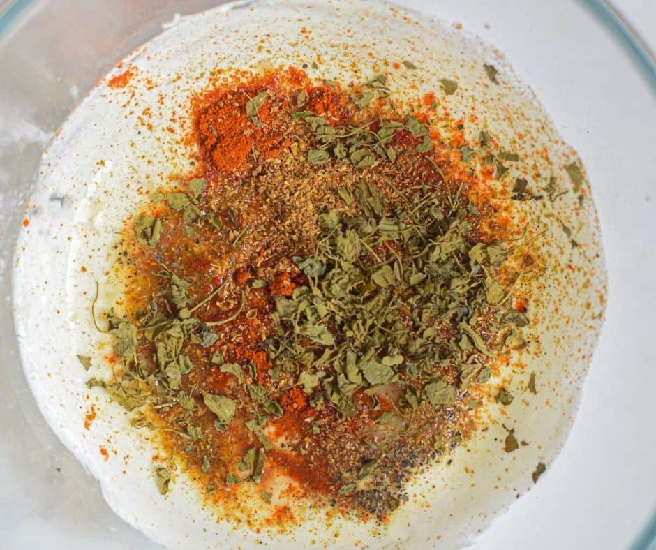 Prepare the spice mixture in a large mixing bowl.