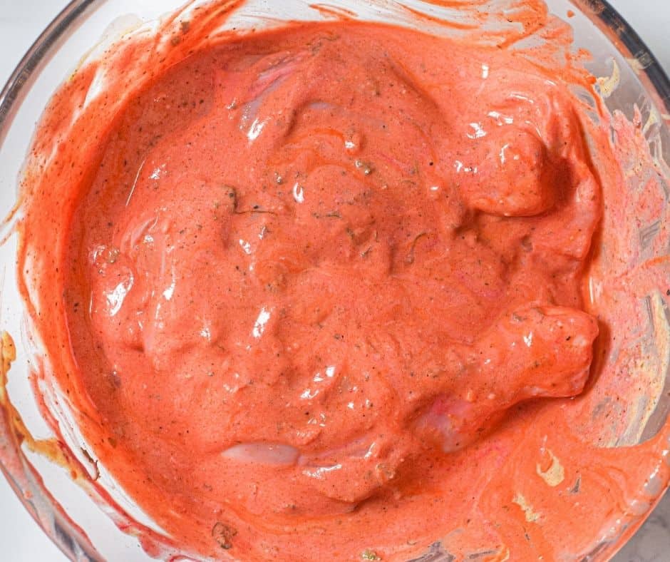 Place the chicken in the marinade.