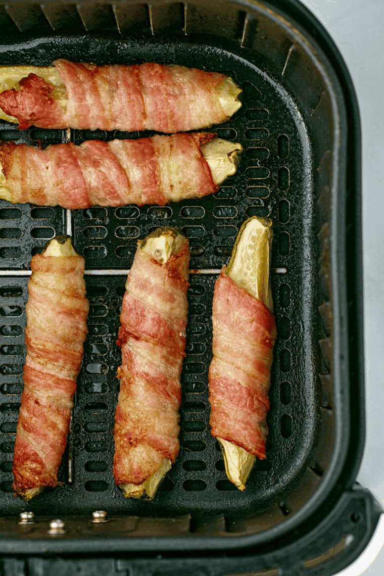 Air fryer bacon wrapped pickles cooked until crispy and golden