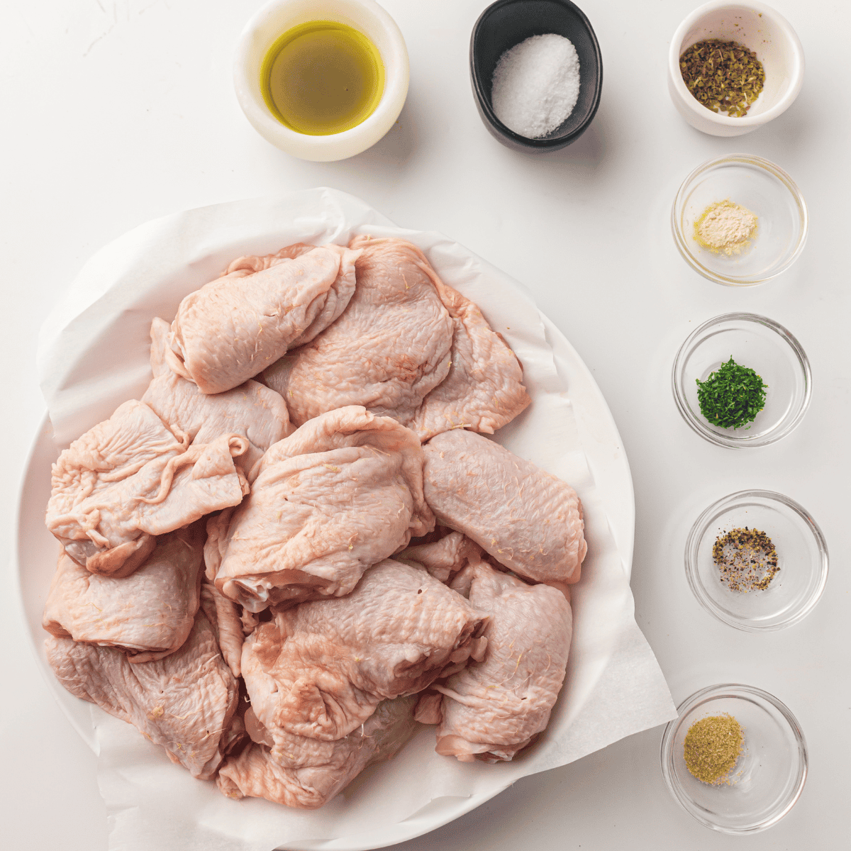 Ingredients needed for Smoky Air Fryer Chicken Thighs on kitchen table.