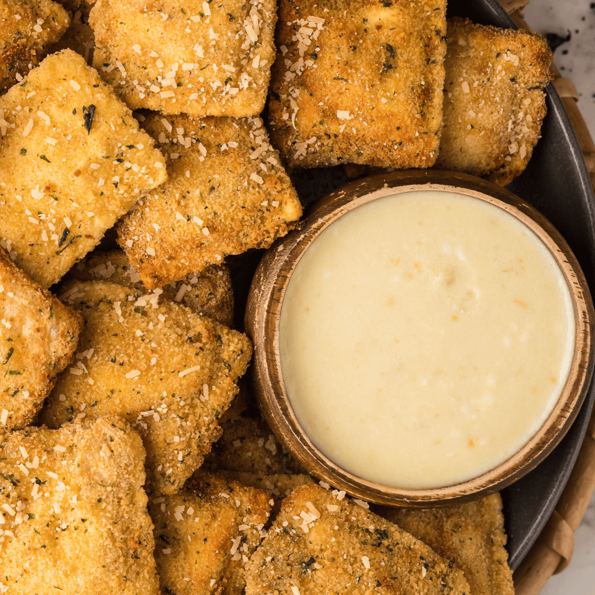 Rich, creamy Alfredo Dipping Sauce with garlic and Parmesan, perfect for dipping breadsticks and veggies.